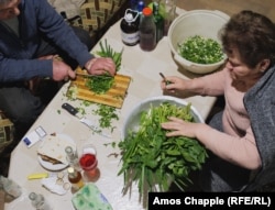 Herbs for jingalov hats being prepared in a house in Abovyan ahead of a birthday celebration.