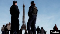 Security officers in Paris, where the 2024 Summer Olympics will open later this year. 