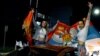 Жени празнуват по улиците на Подгорица, развявайки знамената на Черна гора и Сърбия, след победата на Яков Милатович на президентските избори в неделя, 02 април 2023 г.