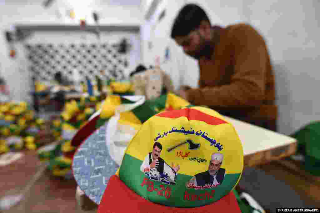 Workers in Karachi manufacture baseball caps for the Balochistan National Party (Mengal), depicting images of party leaders and their symbol of an axe.