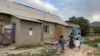 Kazakhstan - Women and children live for years in temporary houses in Shymkent