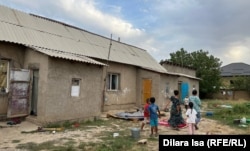 Houses such as this one on the outskirts of Shymkent are home to many impoverished families.