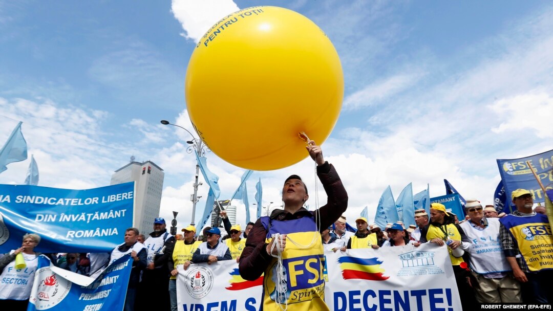 Romanian teachers chant anti-government slogans during a union protest in front of government headquarters in Bucharest on May 10.