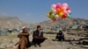 A vendor sells colorful balloons on the Nowruz day in Kabul, March 21, 2023. 