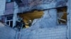 Rescuers work at the site of a building damaged during a Russian suicide drone strike in Kyiv on May 28.