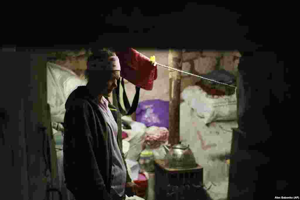 Sixty-seven-year-old Lubov Doroshenko stands in a small shelter in her house in the village of Bohorodychne, Ukraine, amid Russia&#39;s invasion.