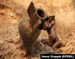 Vuk, an orphaned fox that was a popular Hungarian children's cartoon, clings to a bomb embedded in a Budapest embankment.