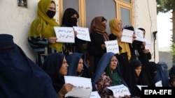 Afghan women hold a protest to demand their right to education and employment in Mazar-e-Sharif earlier this year. 