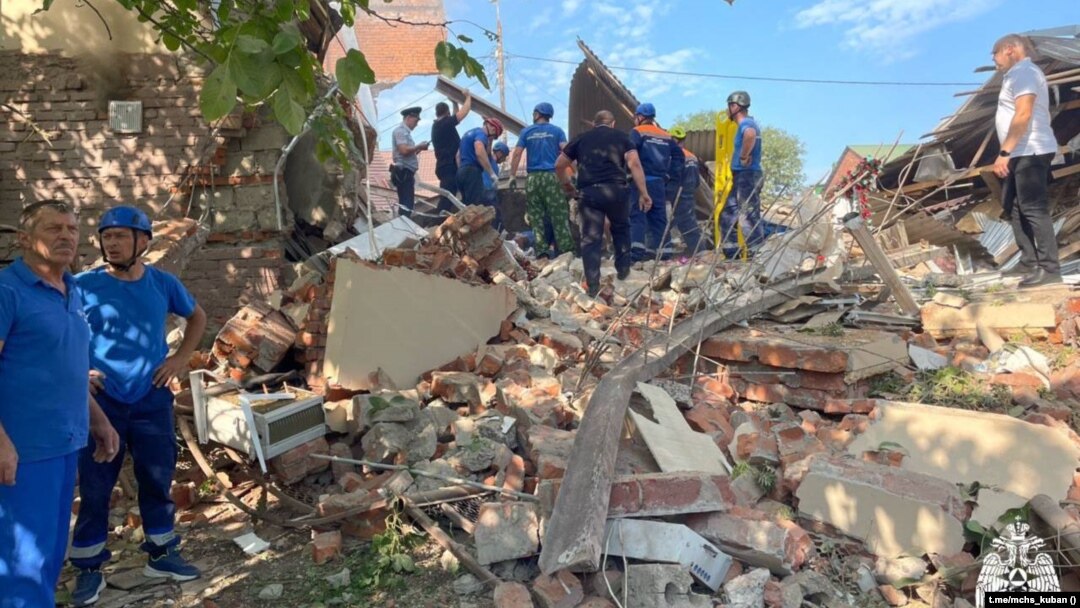 Emergency personnel work at the scene of the destroyed shopping center in Apsheronsk on July 22.