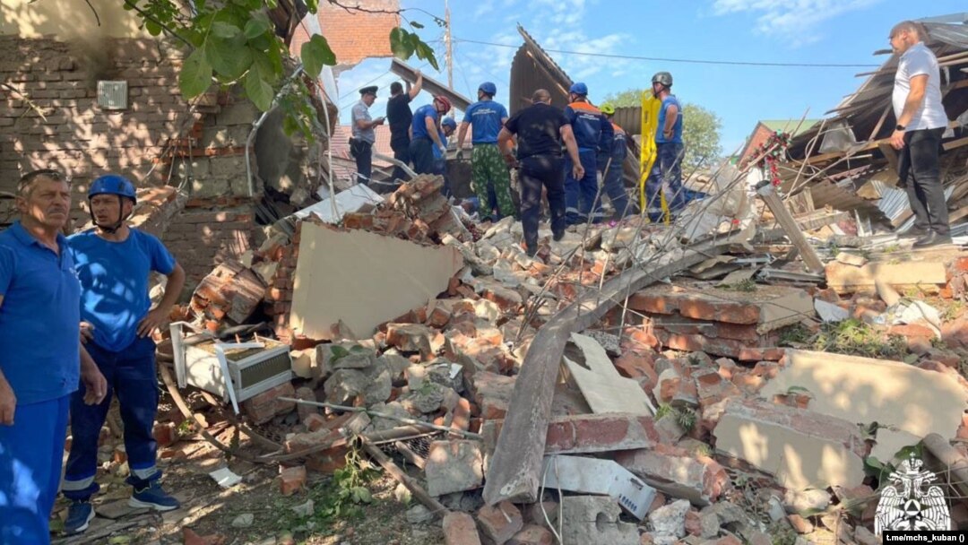 Emergency personnel work at the scene of the destroyed shopping center in Apsheronsk on July 22.