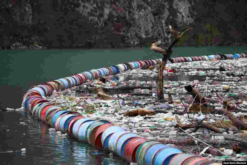 Furtula says the rubbish, which also includes the occasional home appliance, is carried from the Drina&#39;s upstream tributaries, where rising water levels after heavy rains or snow wash garbage from nearby waste sites into the river.