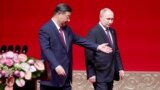 Chinese leader Xi Jinping (left) and Russian President Vladimir Putin in Beijing on May 16 during a two-day state visit. 