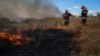 Ukrainian firefighters deal with a grass fire near a frontline position in the Zaporizhzhya Oblast on September 3.<br />
<br />
Senior Ukrainian military figures have claimed that Russia&rsquo;s first and strongest line of defense has been breached in this southern region.&nbsp;