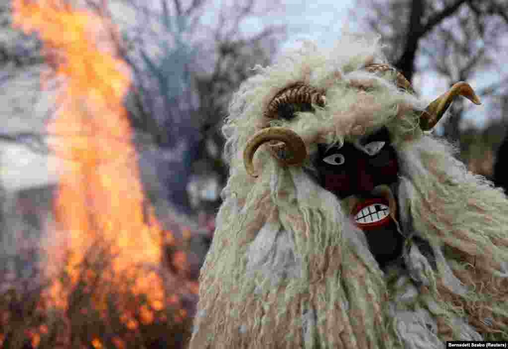 A reveler wears a mask during the traditional Buso Carnival in Mohacs, Hungary.&nbsp;