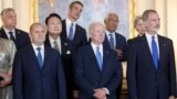 U.S. President Joe Biden (front center) and Hungarian Prime Minister Viktor Orban (back left) -- along with other European leaders -- attend a NATO event in Madrid in June 2022. Biden has excluded Orban from the list of invitees to his Summit for Democracy twice: in 2021 and this week.
