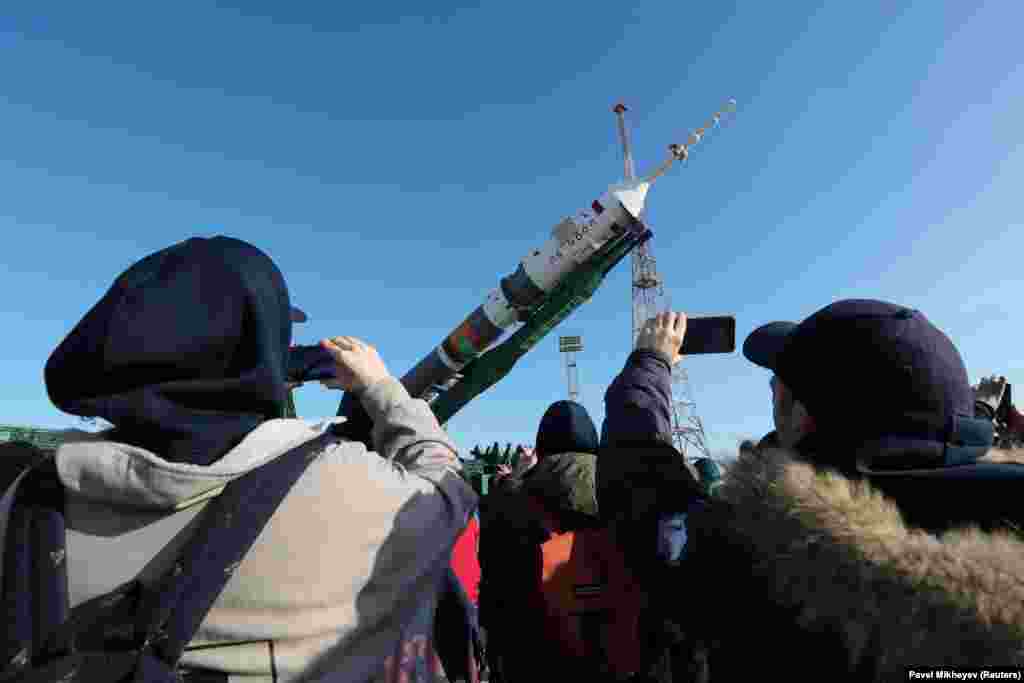 People take pictures of the rocket as it is prepared for launch. Kazakhstan, which has a long and complex relationship with Russia, is building relationships with countries, particularly those in the European Union, to diversify its economic and political ties.
