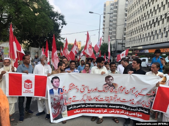 Members of the National Democratic Movement, the Pashtunkhwa National Awami Party, and the Awami Workers Party protest in Karachi on July 21 against the shooting at the peace rally in Bannu two days earlier.