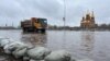 A truck drives through a flooded street in the city of Aqtobe. Officials said the massive<strong>&nbsp;</strong>floods&nbsp;were triggered by an abrupt period of warm weather that led to a huge snowmelt.