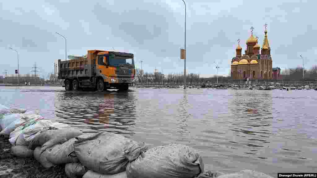 A truck drives through a flooded street in the city of Aqtobe. Officials said the massive&nbsp;floods&nbsp;were triggered by an abrupt period of warm weather that led to a huge snowmelt.