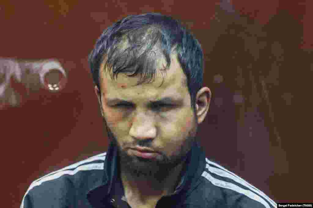 Shamsiddin is seen here pictured in court in Moscow on March 24 with a swollen and bruised face. Earlier, the Tajik man was filmed as he was apparently being tortured by security forces with an electrical cable attached to his genitals. Aiden Aslin, a British national who was captured by Russia while fighting for Ukraine during the battle of Mariupol, told RFE/RL that he believes the publication of apparent torture of the terror suspects is intended to &quot;set an example.&quot; The former Ukrainian marine says such abuse of suspects yet to be found guilty of any crime is at &quot;the same level&quot; as the extrajudicial violence he says he witnessed while in Russian captivity.&nbsp;