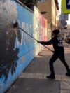 Exiled Expression: A Russian Street Artist's Defiant Political Activism From Abroad  Exiled Expression: A Russian Street Artist's Defiant Political Activism From Abroad