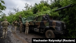 Ukrainian artillerymen prepare a Caesar self-propelled howitzer to fire at positions of Russian troops near Avdiyivka.