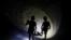 UKRAINE -- Children play in the dark with the aid of flashlights in a residential area during an electricity blackout in Kyiv, Ukraine, 26 August 2024,
