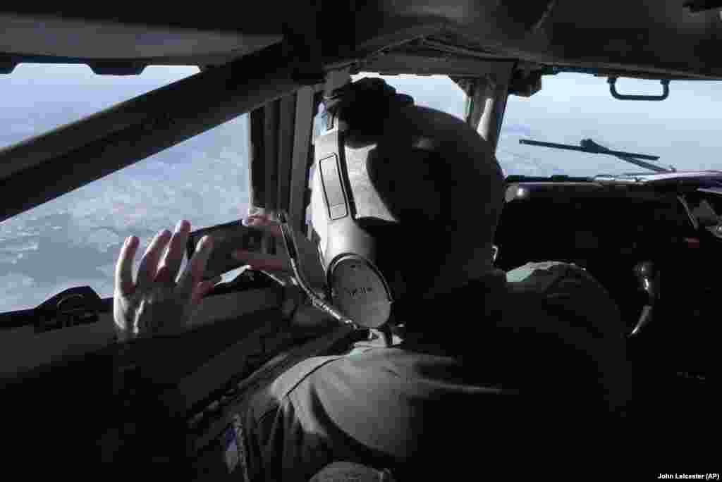 A crew member snaps a souvenir photo from the cockpit of a French military Airborne&nbsp;Warning and Control System (AWACS) surveillance plane as it flies a 10-hour reconnaissance mission from central France to Romanian airspace and back on January 9. Its mission as it peered across southern Ukraine and the Black Sea to Russian-occupied Crimea&nbsp;and beyond&nbsp;was to collect real-time ground-based intelligence for the NATO military alliance.