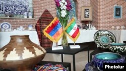 Armenia - Armenian and Iranian flags are displayed during an Iranian art exhibition at the Blue Mosque complex in Yerevan, March 27, 2023.