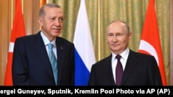 Russian President Vladimir Putin (right) and Turkish President Recep Tayyip Erdogan pose prior to talks in Sochi, Russia, on September 4.