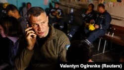 Kyiv Mayor Vitali Klitschko takes cover inside a shelter with residents during an air-raid alert in the Ukrainian capital on June 1.