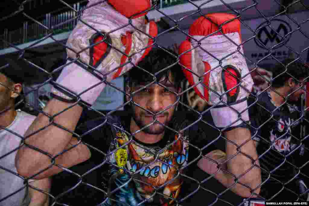 An Afghan man looks on during a mixed martial arts class at a club in Kabul. The Taliban administration has officially banned Mixed Martial Arts (MMA)/Free Fight, deeming it incompatible with Islamic teachings. It was announced by the Ministry for the Promotion of Virtue and Prevention of Vice to the National Olympic and Physical Training Committee, citing concerns over violence and safety risks associated with the sport.