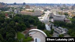 UKRAINE – An aerial view of the city center, with an arch of a Soviet-era monument to represent Ukraine and Russia's friendship in the foreground, in Kyiv, Ukraine, Tuesday, June. 23, 2020dei