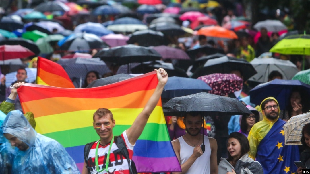 People brave the rain to attend the Pride Parade in Sofia on June 17.