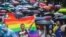 People brave the rain to attend the Pride Parade in Sofia on June 17.