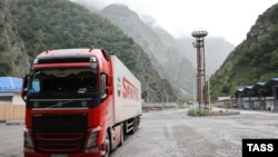 An Armenian truck carrying agricultural produce passes through the Georgian-Russian border crossing at Upper Lars, June 21, 2023.