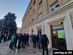 A small crowd lines up to vote in Azerbaijan's presidential election on February 7.
