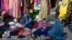 Afghan women sell secondhand clothes in the Jada-e Maiwand area in Kabul on January 17.