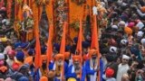Sikh pilgrims take part in a ritual procession on the occasion of the birth anniversary of Guru Nanak Dev, the founder of Sikhism, in Nankana Sahib, Punjab Province, Pakistan.