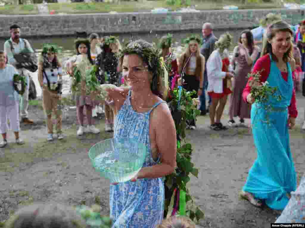 Women are sprayed with water during a ritual that closed the event. After news of the July 8 missile strikes broke, Vesela said, &ldquo;one group of folk singers that volunteered to perform told me they didn&#39;t want to sing on the same day.&quot; After the organizer promised to donate all money raised from the event to victims of the attacks, &quot;they agreed to come,&quot; she said.&nbsp;&nbsp; &nbsp;