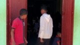 Wadi Halfa, Sudan -- Children at the entrance of a makeshift shelter for Sudanese IDP's