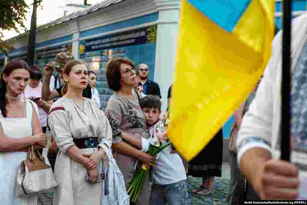 Mourners listen to music and speeches honoring Babinskiy, who was serving as a combat medic when he was killed in the Zaporizhzhya region on August 8.