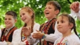 Ukrainian children applaud a group performing at the Vyshyvanka Fest, which took place in the Holesovice district of Prague&nbsp;on May 19.&nbsp;