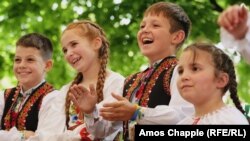 Ukrainian children applaud a group performing at the Vyshyvanka Fest, which took place in the Holesovice district of Prague&nbsp;on May 19.&nbsp;