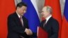 Підсудний Путін і хитрий Сі: яку мету переслідує лідер Китаю Сі Цзіньпін, потискаючи руку президенту Росії
