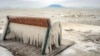 Ice covers a bench on the shore of Lake Balaton in Balatonfenyves, Hungary, as the temperature dropped to minus 6 degrees Celsius accompanied by strong winds.