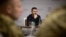 Ukrainian President Volodymyr Zelenskiy attend a meeting with top military officials in the Kharkiv region on May 16. 