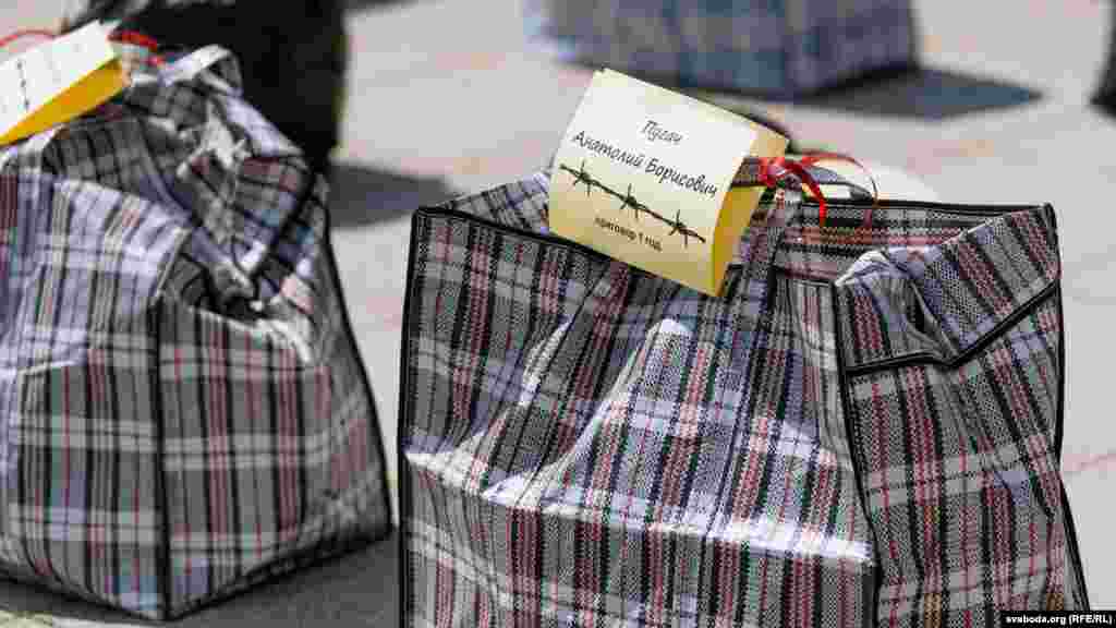 The bags represent what political prisoners are allowed to carry when they are moved to a penal colony. Each bag contains the name of a political prisoner and their sentence.