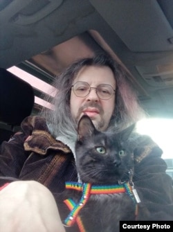 Дмитрий Кузьмин и украинский кот Саня, 2022