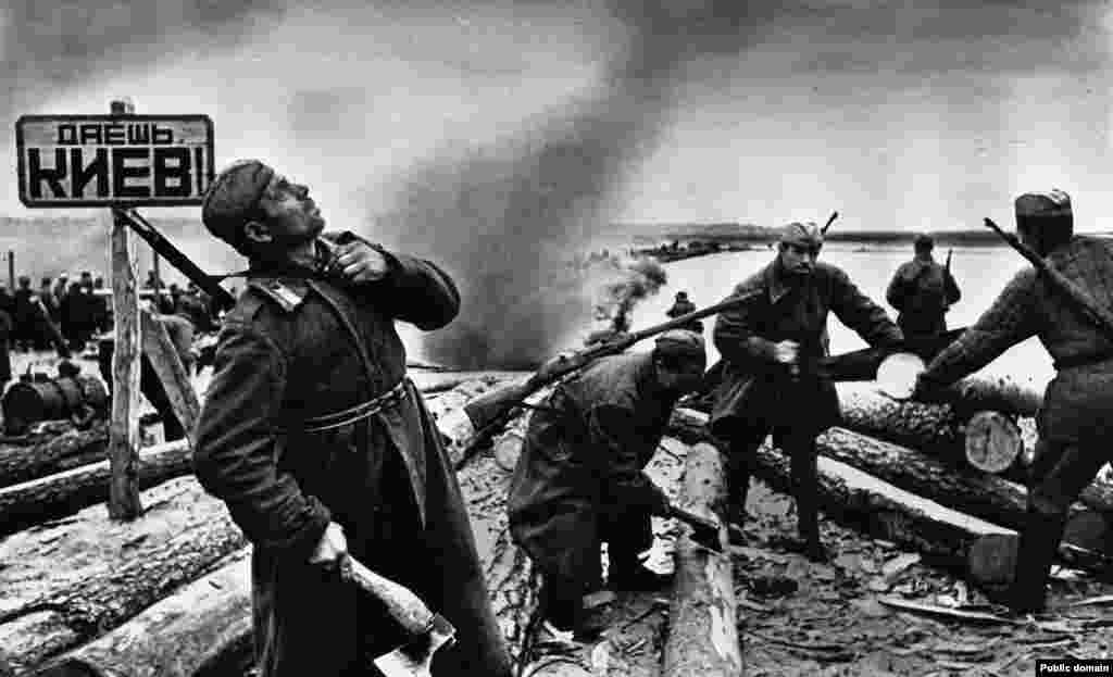 Soviet soldiers prepare to cross the Dnieper River in 1943. The sign on the left says: &quot;To Kyiv!&quot;&nbsp; After the Red Army&#39;s defeat of German-led forces at Stalingrad, the tide of the Nazi advance across the Soviet Union turned. Fighting yet again returned to the territory of today&#39;s Ukraine as the Soviet Red Army pushed west.&nbsp;